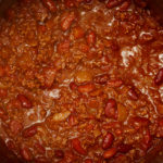 How can I make homemade chili more flavorful