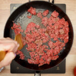 Ground beef being cooked in a skillet